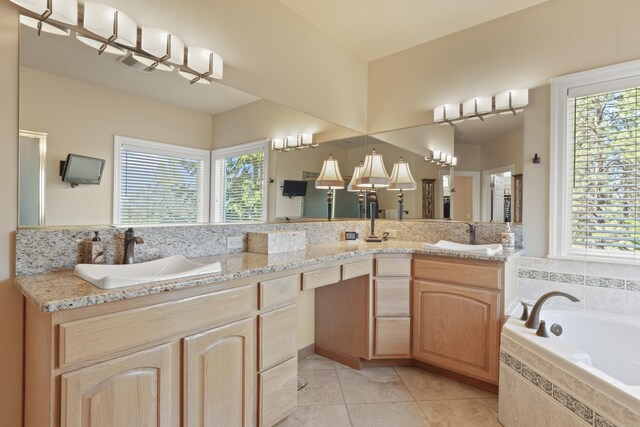 6815 S Palouse Hwy, Spokane, WA 99223 - bathroom featuring healthy amount of natural light, tile patterned flooring, double vanity, and a garden tub