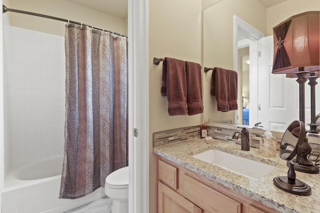 6815 S Palouse Hwy, Spokane, WA 99223 - bathroom with vanity, shower / bath combo, and tasteful backsplash
