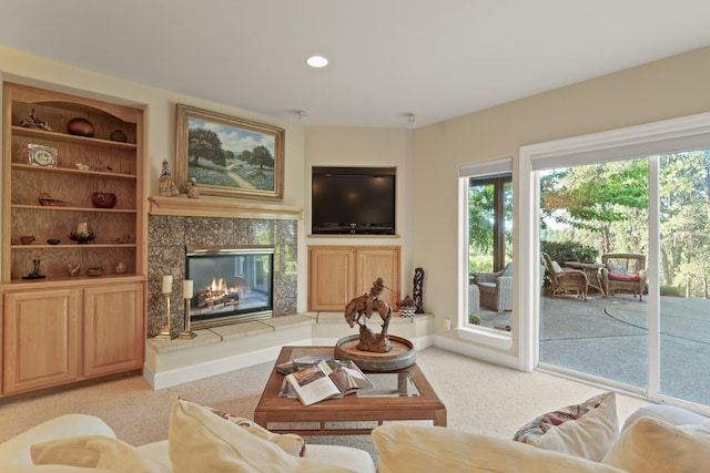 6815 S Palouse Hwy, Spokane, WA 99223 - living room with light carpet, a tile fireplace, and recessed lighting