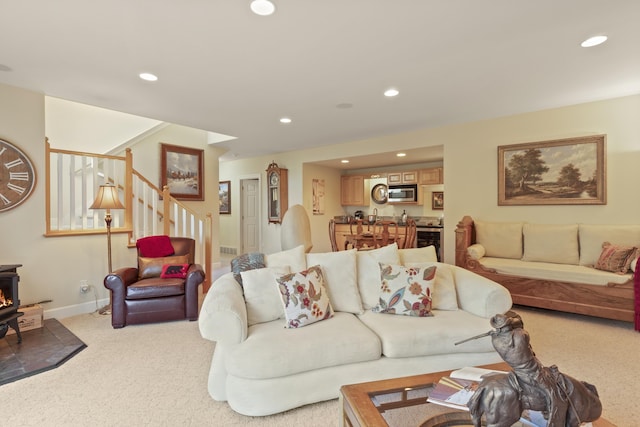 6815 S Palouse Hwy, Spokane, WA 99223 - living area with stairway, light carpet, recessed lighting, and a wood stove