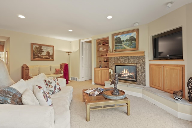 6815 S Palouse Hwy, Spokane, WA 99223 - living area with light colored carpet, recessed lighting, built in shelves, and a fireplace