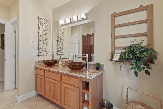 6815 S Palouse Hwy, Spokane, WA 99223 - full bath featuring double vanity and baseboards