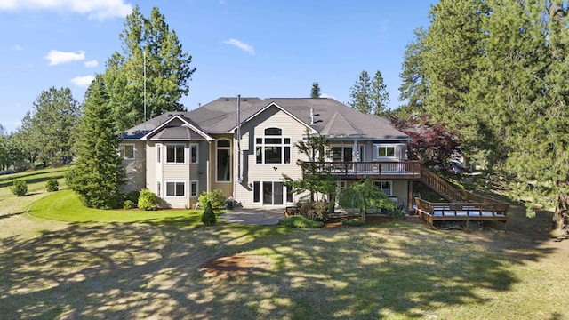 6815 S Palouse Hwy, Spokane, WA 99223 - view of front of house with a patio, a wooden deck, a front lawn, and stairs