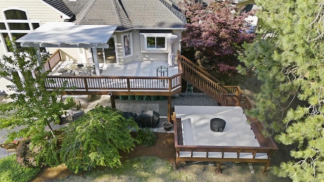 6815 S Palouse Hwy, Spokane, WA 99223 - back of property featuring a wooden deck and roof with shingles