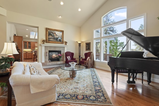 6815 S Palouse Hwy, Spokane, WA 99223 - living room featuring recessed lighting, a fireplace, wood finished floors, and high vaulted ceiling