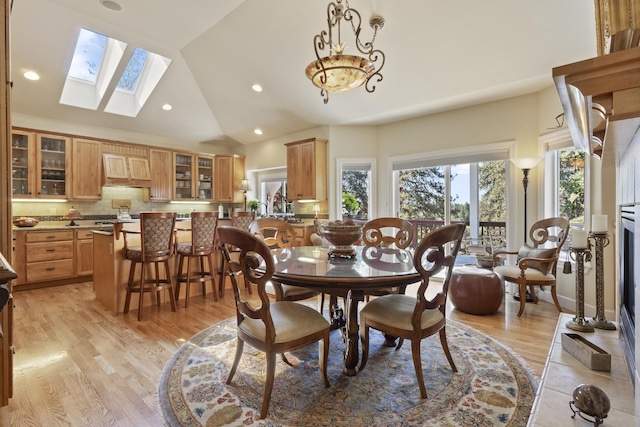 6815 S Palouse Hwy, Spokane, WA 99223 - dining room with vaulted ceiling, light wood-style floors, recessed lighting, and a skylight