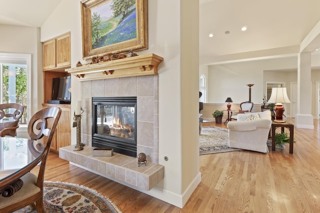 6815 S Palouse Hwy, Spokane, WA 99223 - living area featuring a tiled fireplace, light wood-style floors, and recessed lighting