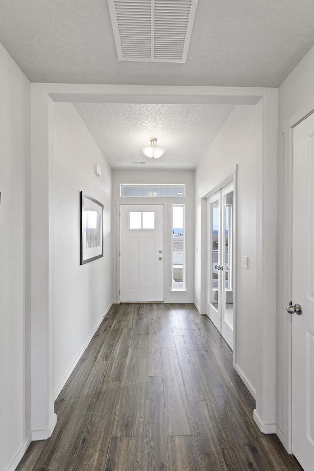 14 N Drummond St, Spokane Valley, WA 99016 - entrance foyer featuring dark wood-type flooring, french doors, and a textured ceiling
