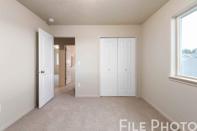14 N Drummond St, Spokane Valley, WA 99016 - unfurnished bedroom featuring light colored carpet and a closet