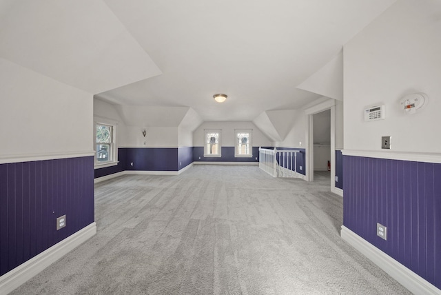 1434 W 8th Ave, Spokane, WA 99204 - additional living space featuring carpet flooring, vaulted ceiling, plenty of natural light, and a wainscoted wall