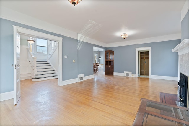 1434 W 8th Ave, Spokane, WA 99204 - living area with stairs, light wood-type flooring, and a fireplace