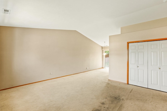 17506 E 3rd Ln, Greenacres, WA 99016 - unfurnished bedroom featuring light carpet, vaulted ceiling, and a closet