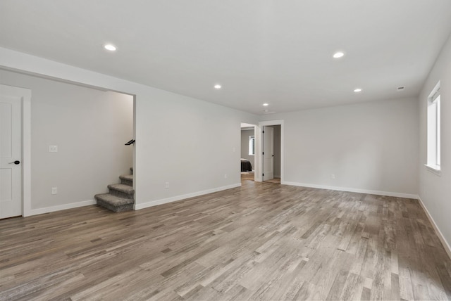 826 Thomas Ln, Newport, WA 99156 - unfurnished living room with stairs, light wood-style floors, and recessed lighting