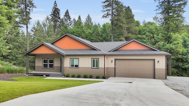 826 Thomas Ln, Newport, WA 99156 - view of front of home featuring an attached garage, concrete driveway, roof with shingles, and a front lawn