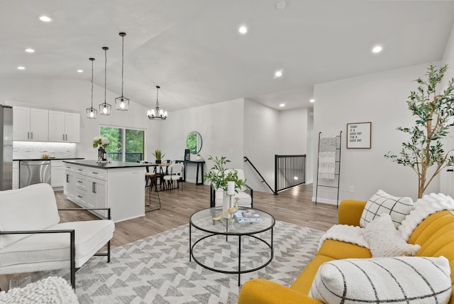 826 Thomas Ln, Newport, WA 99156 - living room featuring light wood-style flooring, lofted ceiling, a chandelier, and recessed lighting