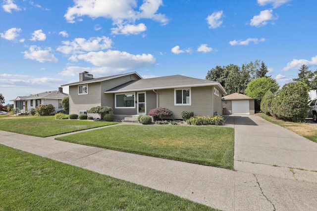 4523 N Royal Ct, Spokane, WA 99205 - tri-level home featuring an outbuilding, a garage, a chimney, a front lawn, and concrete driveway
