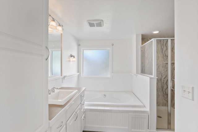 4523 N Royal Ct, Spokane, WA 99205 - full bathroom with vanity, a bath, a stall shower, and wainscoting