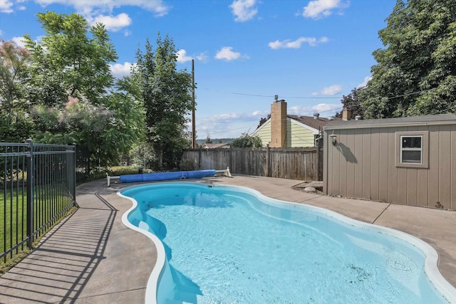 4523 N Royal Ct, Spokane, WA 99205 - view of pool featuring a fenced backyard, a patio, and an outbuilding