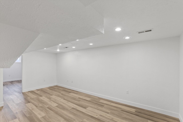 4523 N Royal Ct, Spokane, WA 99205 - unfurnished room with light wood-style flooring, recessed lighting, and a textured ceiling