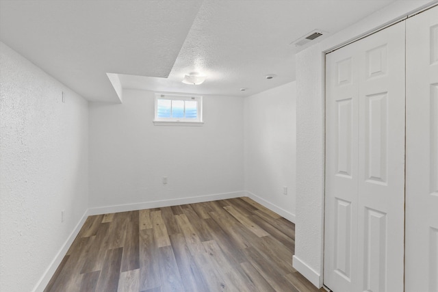 4523 N Royal Ct, Spokane, WA 99205 - basement featuring wood finished floors and a textured ceiling