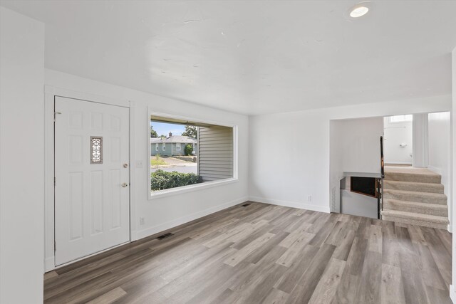4523 N Royal Ct, Spokane, WA 99205 - unfurnished living room featuring wood finished floors and stairs