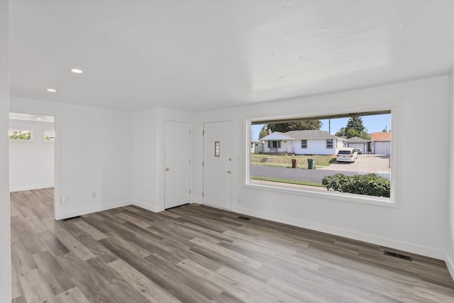 4523 N Royal Ct, Spokane, WA 99205 - unfurnished living room with healthy amount of natural light, wood finished floors, and recessed lighting