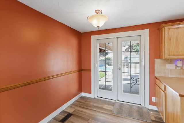 4523 N Royal Ct, Spokane, WA 99205 - doorway to outside with french doors and wood finished floors