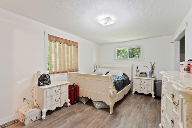 6221 N Highview Ln, Spokane Valley, WA 99217 - bedroom with wood finished floors and a textured ceiling