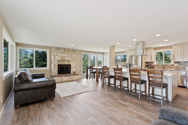 6221 N Highview Ln, Spokane Valley, WA 99217 - living room with plenty of natural light, light wood-style floors, a fireplace, and recessed lighting