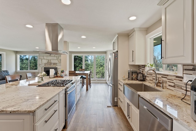 6221 N Highview Ln, Spokane Valley, WA 99217 - kitchen featuring appliances with stainless steel finishes, island exhaust hood, healthy amount of natural light, open floor plan, and recessed lighting