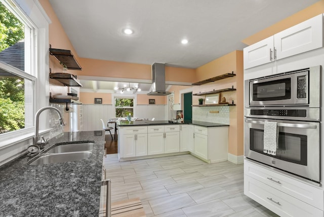 2026 W 9th Ave, Spokane, WA 99204 - kitchen with open shelves, appliances with stainless steel finishes, range hood, a peninsula, and recessed lighting