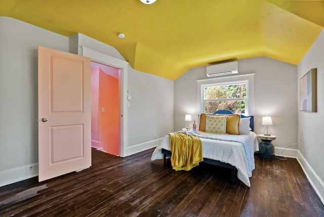 2026 W 9th Ave, Spokane, WA 99204 - bedroom with an AC wall unit, hardwood / wood-style floors, and vaulted ceiling