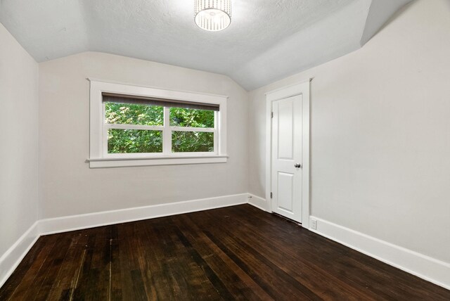 2026 W 9th Ave, Spokane, WA 99204 - empty room featuring lofted ceiling and dark wood finished floors