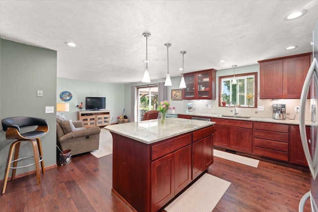 1616 N Ritchey Rd, Reardan, WA 99029 - kitchen featuring open floor plan, glass insert cabinets, healthy amount of natural light, dark wood-style flooring, and recessed lighting