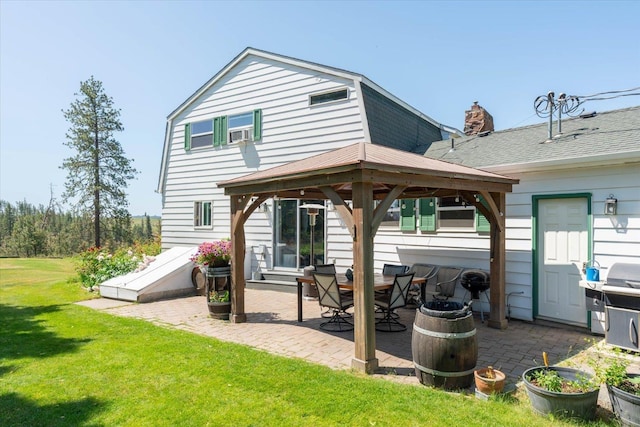 1616 N Ritchey Rd, Reardan, WA 99029 - rear view of property featuring a gazebo, a patio area, a yard, and a chimney