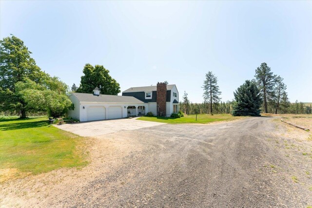 1616 N Ritchey Rd, Reardan, WA 99029 - view of front of home featuring a garage, dirt driveway, and a front yard