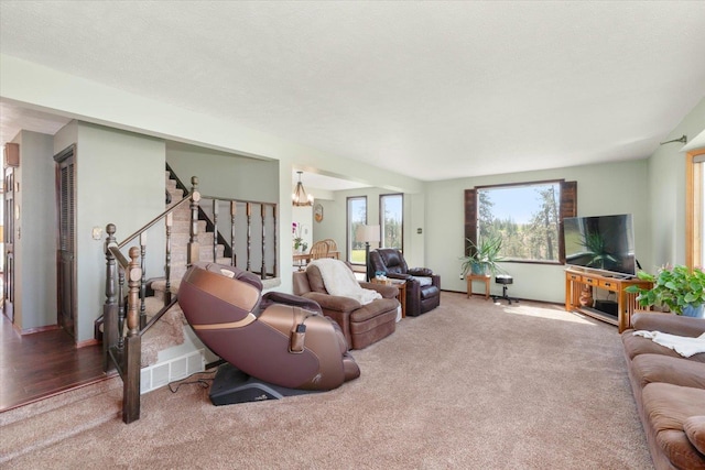 1616 N Ritchey Rd, Reardan, WA 99029 - living area with carpet flooring, stairs, and a chandelier