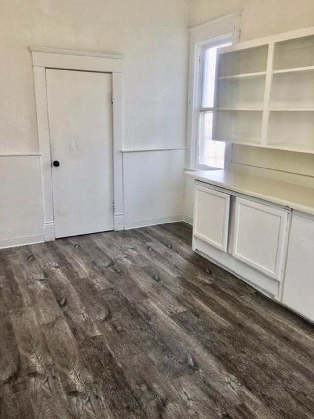 1304 W Maxwell Ave, Spokane, WA 99201 - unfurnished dining area with dark wood-type flooring