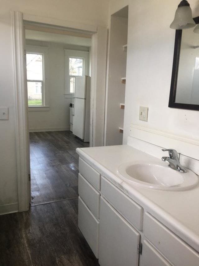 1304 W Maxwell Ave, Spokane, WA 99201 - bathroom featuring vanity and wood finished floors