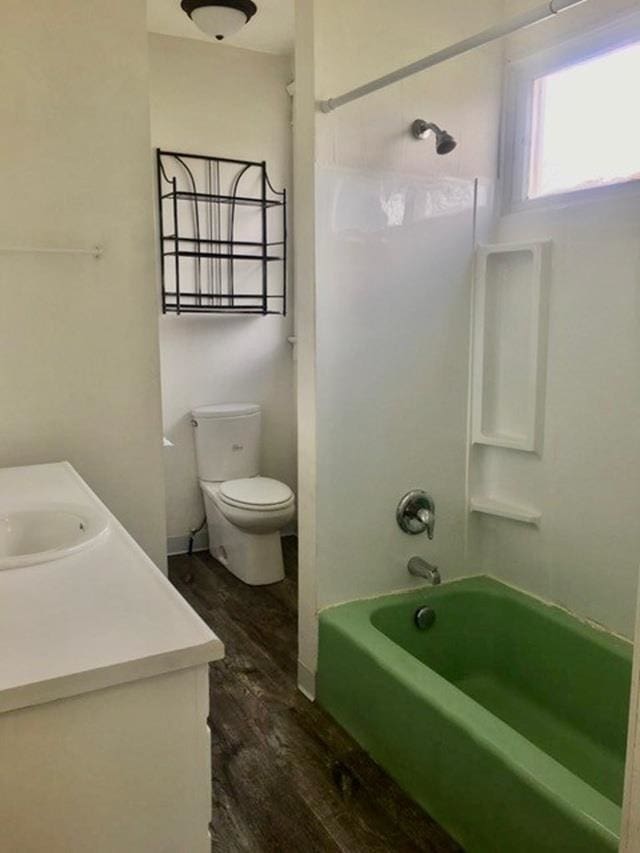 1304 W Maxwell Ave, Spokane, WA 99201 - full bath featuring wood finished floors, vanity, and bathing tub / shower combination
