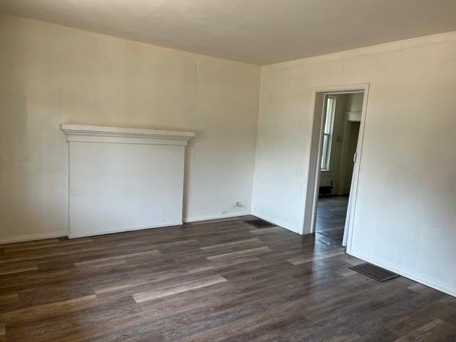 1304 W Maxwell Ave, Spokane, WA 99201 - unfurnished room featuring dark wood-style flooring and baseboards