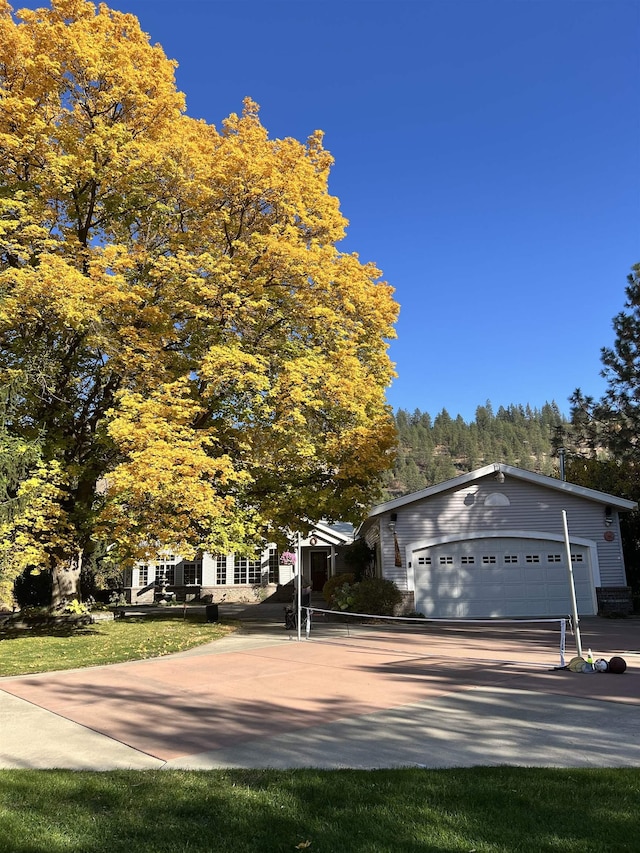1703 W 25th Ave, Spokane, WA 99224 - view of front of home with an attached garage and driveway