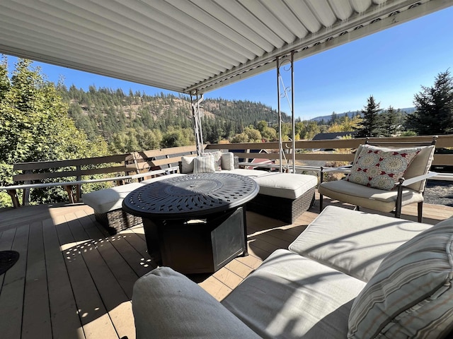 1703 W 25th Ave, Spokane, WA 99224 - wooden deck with an outdoor hangout area, a mountain view, and a wooded view