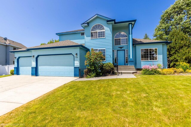 706 S Shelley Lake Ln, Veradale, WA 99037 - traditional-style house featuring driveway, a garage, and a shingled roof