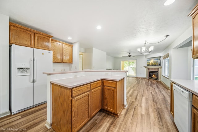 706 S Shelley Lake Ln, Veradale, WA 99037 - kitchen with white appliances, a chandelier, light countertops, light wood-style flooring, and recessed lighting