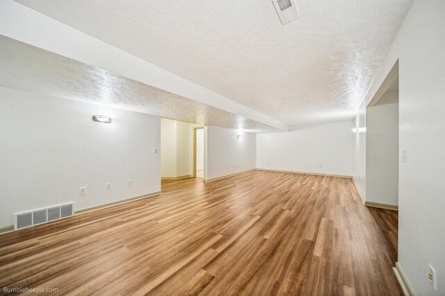 706 S Shelley Lake Ln, Veradale, WA 99037 - spare room with a textured ceiling and light wood-type flooring