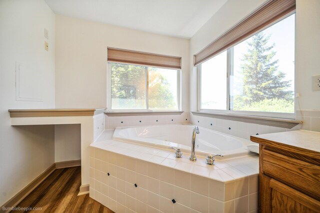 706 S Shelley Lake Ln, Veradale, WA 99037 - full bathroom featuring vanity, a shower stall, a bath, and wood finished floors