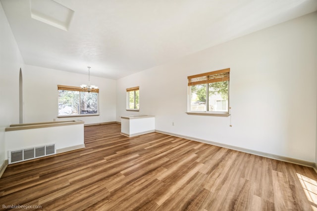 706 S Shelley Lake Ln, Veradale, WA 99037 - empty room with wood finished floors and a chandelier