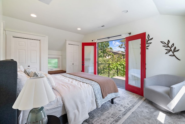 1420 W Main Ave, Spokane, WA 99201 - bedroom featuring access to exterior, vaulted ceiling, two closets, and recessed lighting