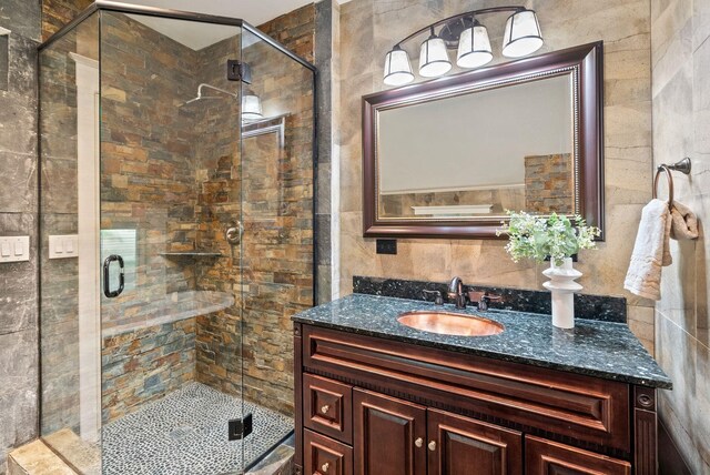 1420 W Main Ave, Spokane, WA 99201 - full bath with tile walls, vanity, and a stall shower